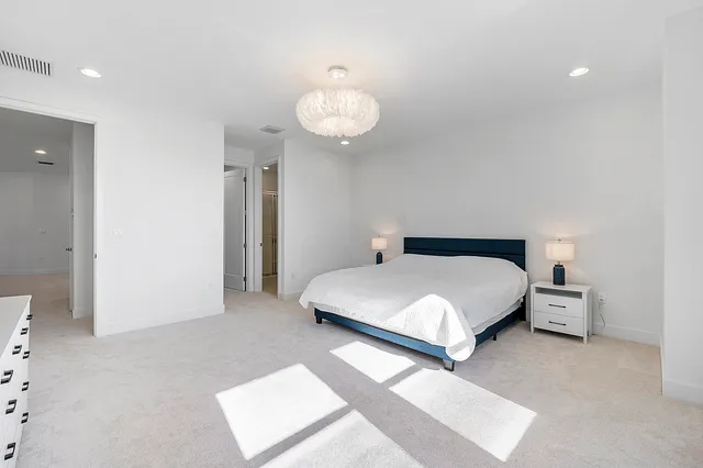 a view of a patio with a dining table and chairs with wooden floor