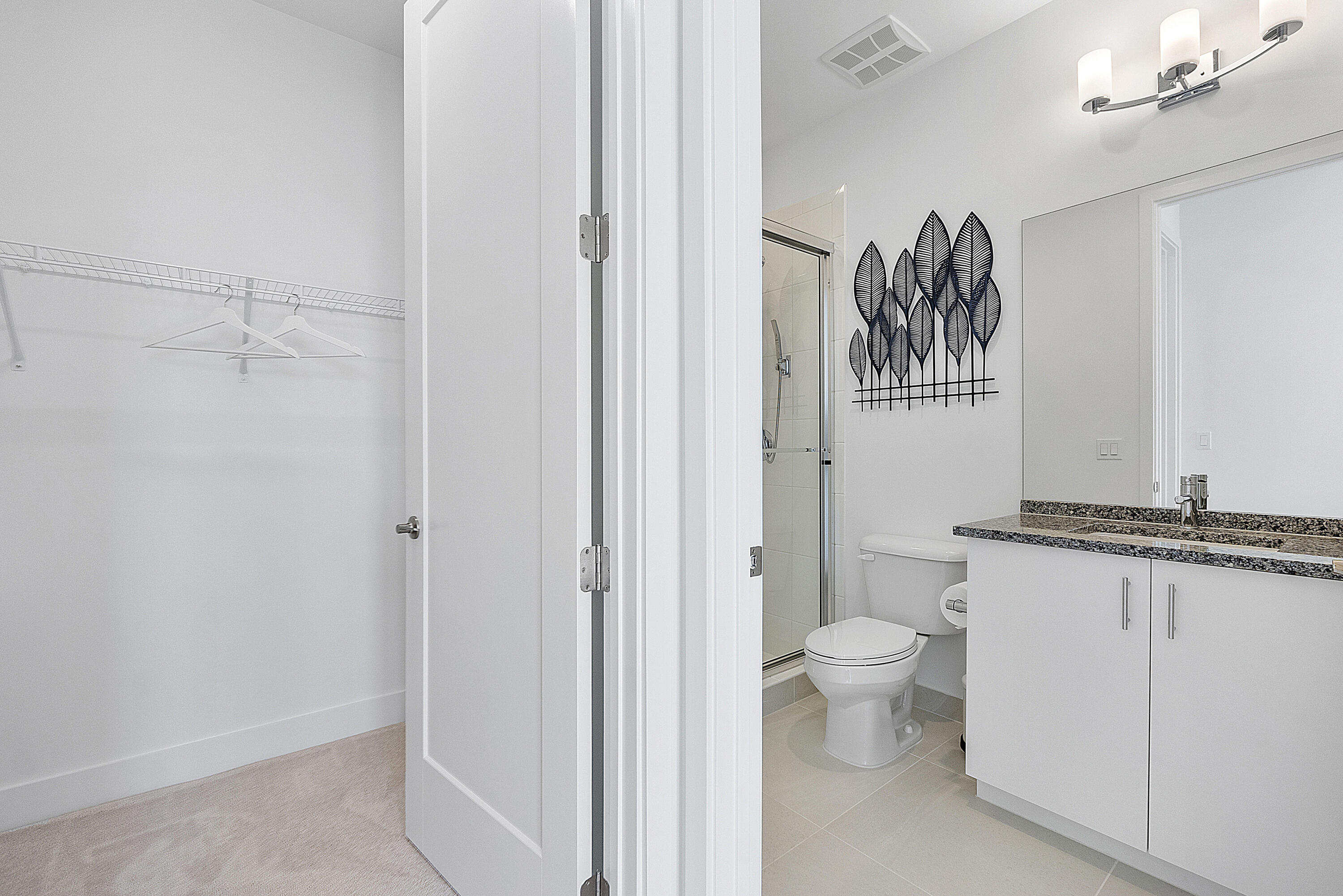20296 Somerset Hls Drive Boca Raton, FL 33434 - Photo 37 of 67 a view of a bathroom with a toilet sink and a mirror