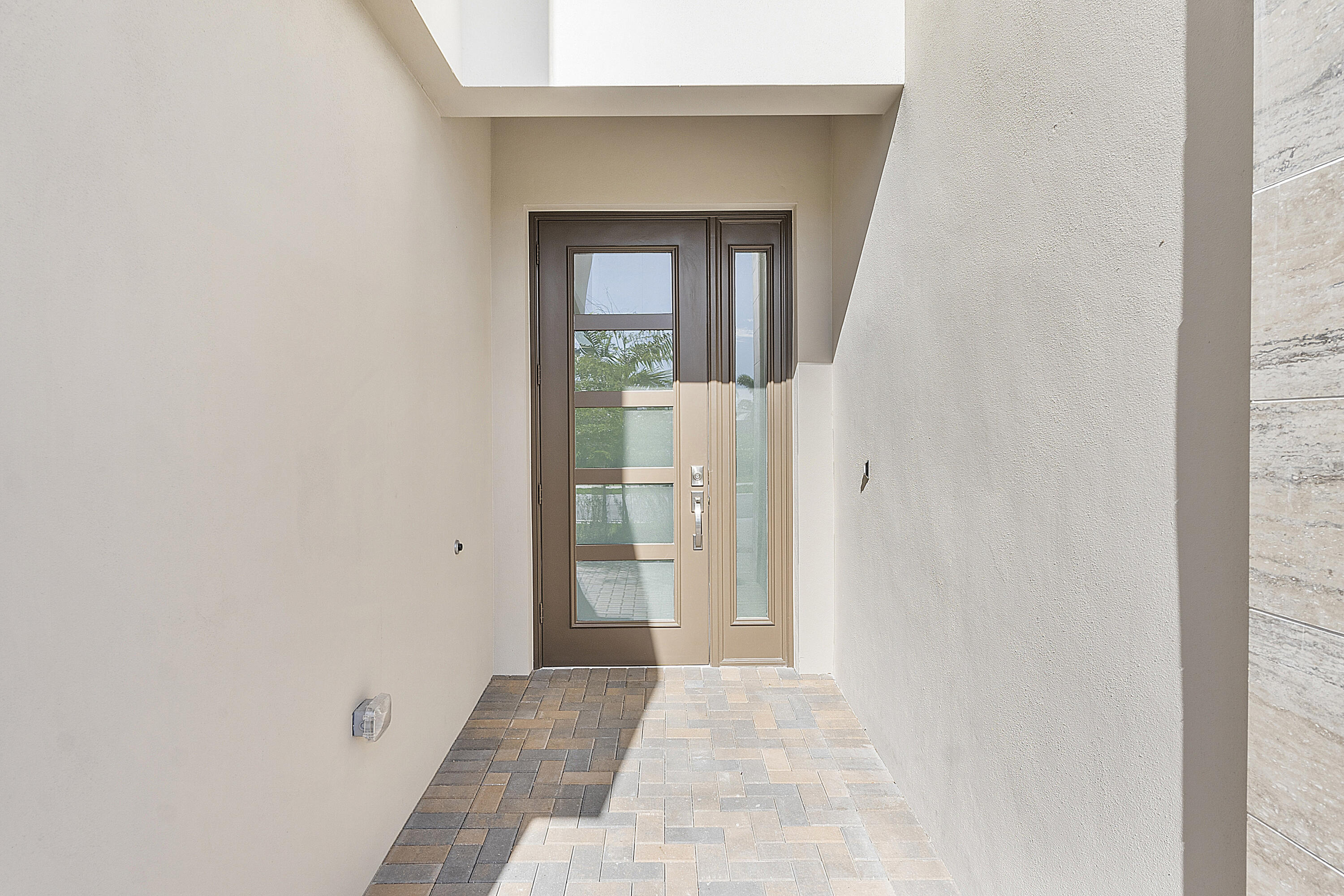 20296 Somerset Hls Drive Boca Raton, FL 33434 - Photo 4 of 67 a view of a hallway with wooden floor and a living room