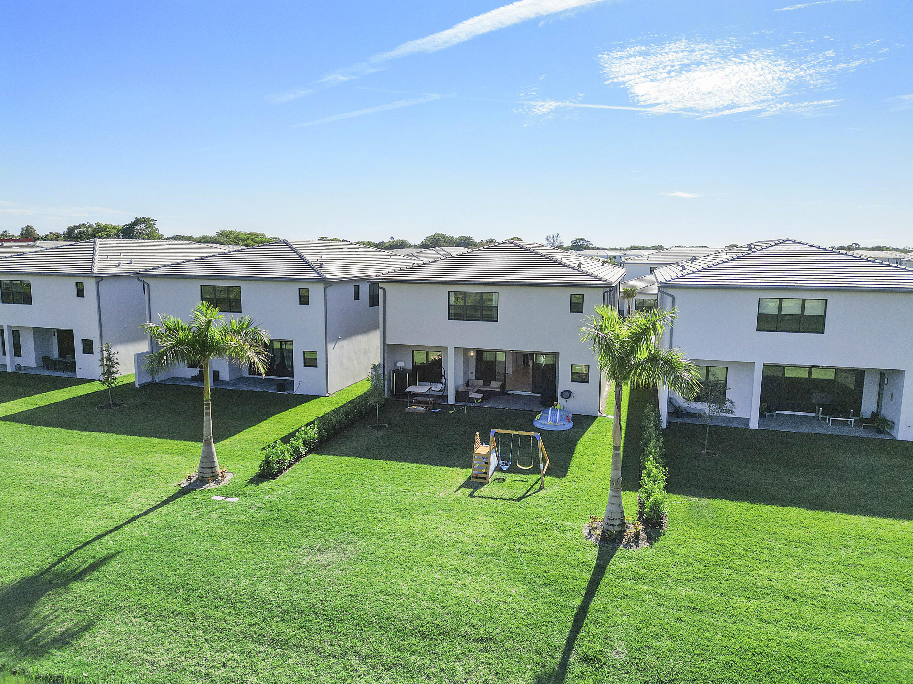 20296 Somerset Hls Drive Boca Raton, FL 33434 - Photo 47 of 67 a view of a house with a backyard and a patio