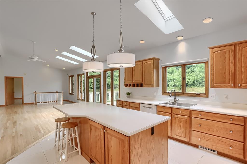 377 Magee Road Sewickley, PA 15143 - Photo 17 of 50 a kitchen with a stove a sink a center island and a window