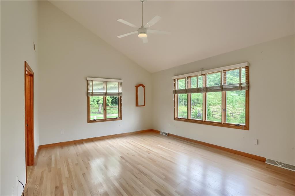 377 Magee Road Sewickley, PA 15143 - Photo 23 of 50 a view of an empty room with a window and wooden floor