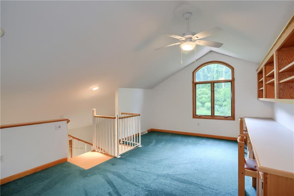 377 Magee Road Sewickley, PA 15143 - Photo 27 of 50 an empty room with wooden floor fan and windows