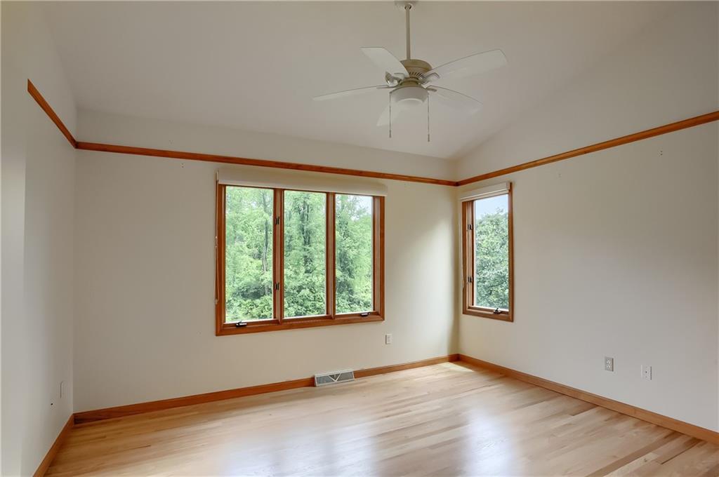 377 Magee Road Sewickley, PA 15143 - Photo 29 of 50 a view of an empty room with a window and wooden floor