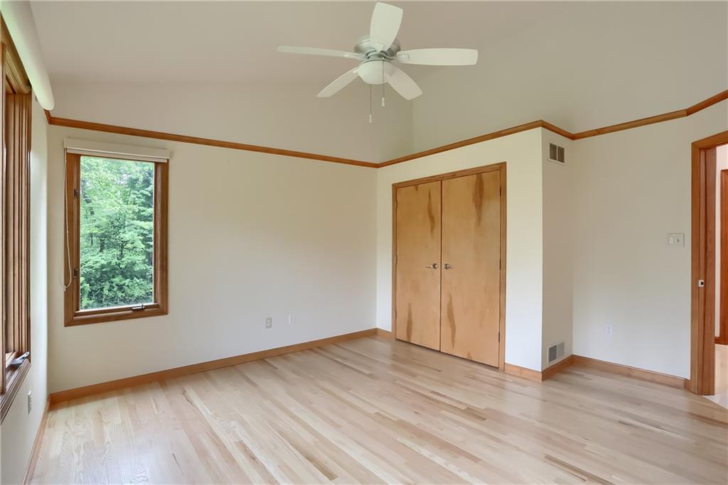 377 Magee Road Sewickley, PA 15143 - Photo 30 of 50 a view of an empty room with wooden floor and a window