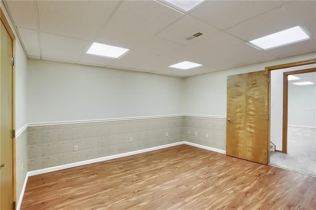 377 Magee Road Sewickley, PA 15143 - Photo 31 of 50 an empty room with wooden floor and windows