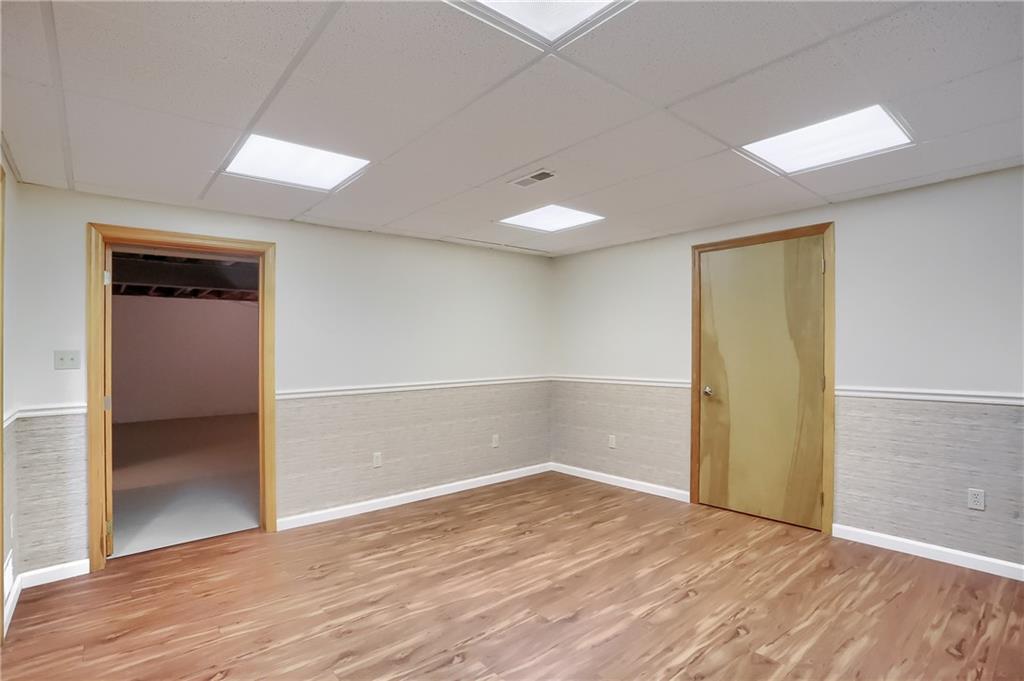 377 Magee Road Sewickley, PA 15143 - Photo 32 of 50 an empty room with wooden floor and entrance