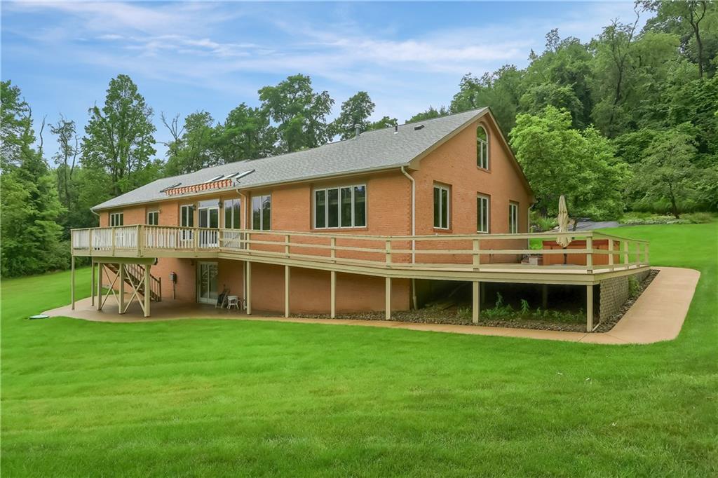 377 Magee Road Sewickley, PA 15143 - Photo 41 of 50 a front view of a house with a yard table and chairs