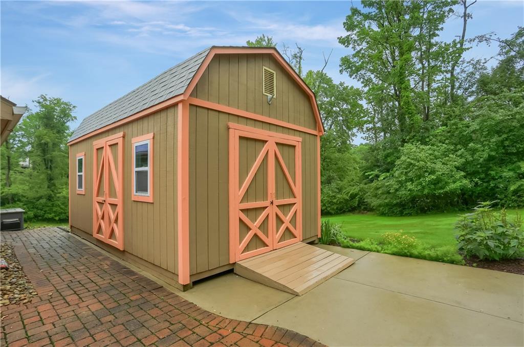 377 Magee Road Sewickley, PA 15143 - Photo 44 of 50 a front view of a house with garden