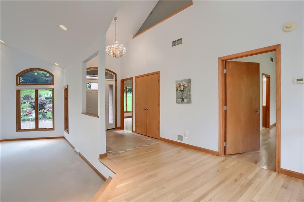 377 Magee Road Sewickley, PA 15143 - Photo 5 of 50 a view of a hallway with wooden floor and cabinet