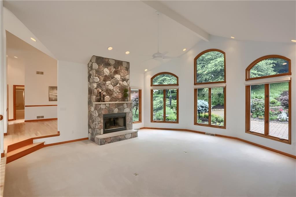 377 Magee Road Sewickley, PA 15143 - Photo 6 of 50 a view of an empty room with a fireplace and a window