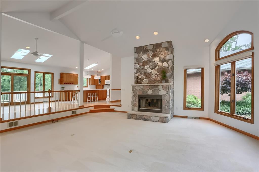 377 Magee Road Sewickley, PA 15143 - Photo 7 of 50 an empty room with fireplace and windows