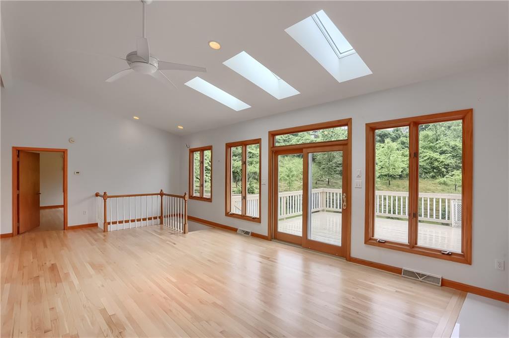 377 Magee Road Sewickley, PA 15143 - Photo 10 of 50 a view of an empty room with wooden floor and a window