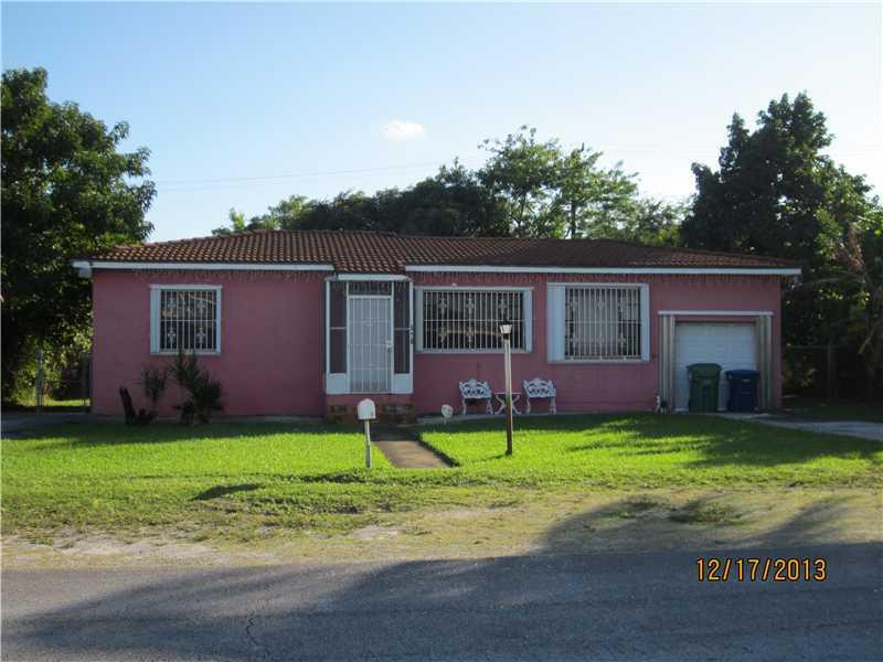 a view of a house with a yard porch and sitting area