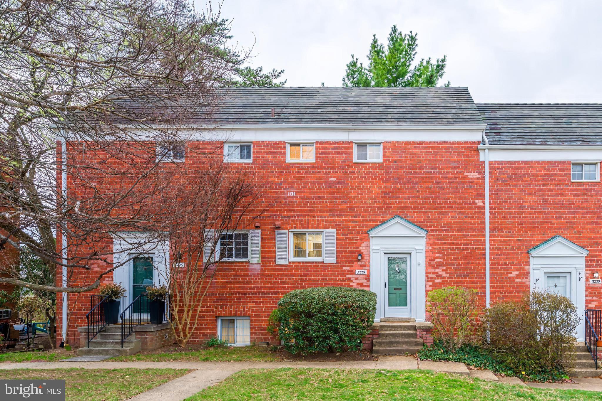 3228 Wellington Road Alexandria, VA 22302 - Photo 2 of 20 a front view of a house with a yard