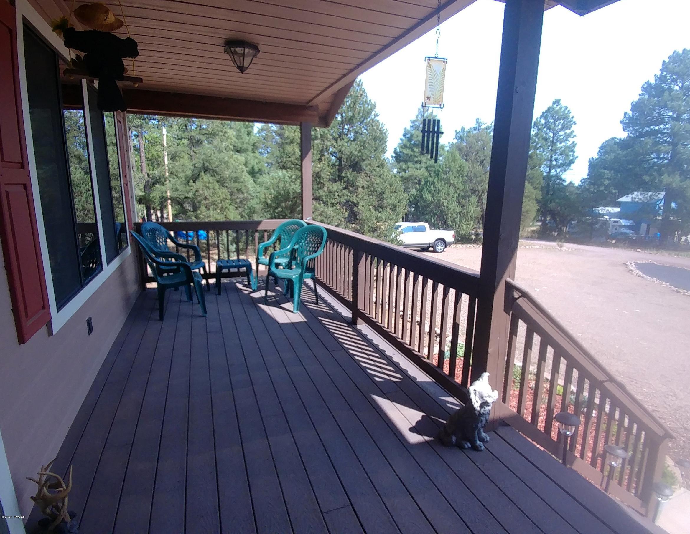 2190 Rimview Trail Overgaard, AZ 85933 - Photo 3 of 45 a view of a two chairs in the balcony