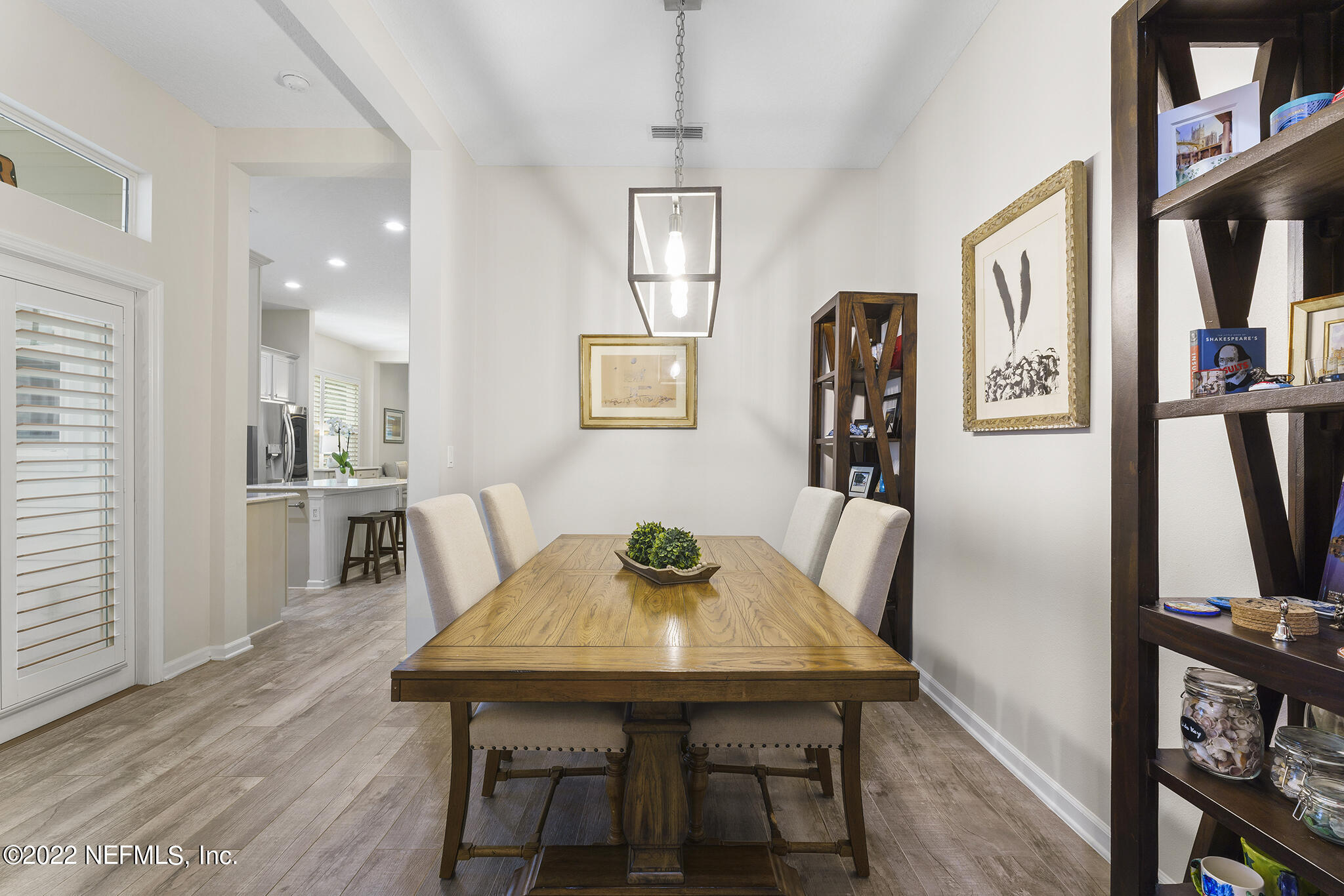 1145 Overdale Road St. Augustine, FL 32080 - Photo 15 of 85 a view of a dining room with furniture and wooden floor