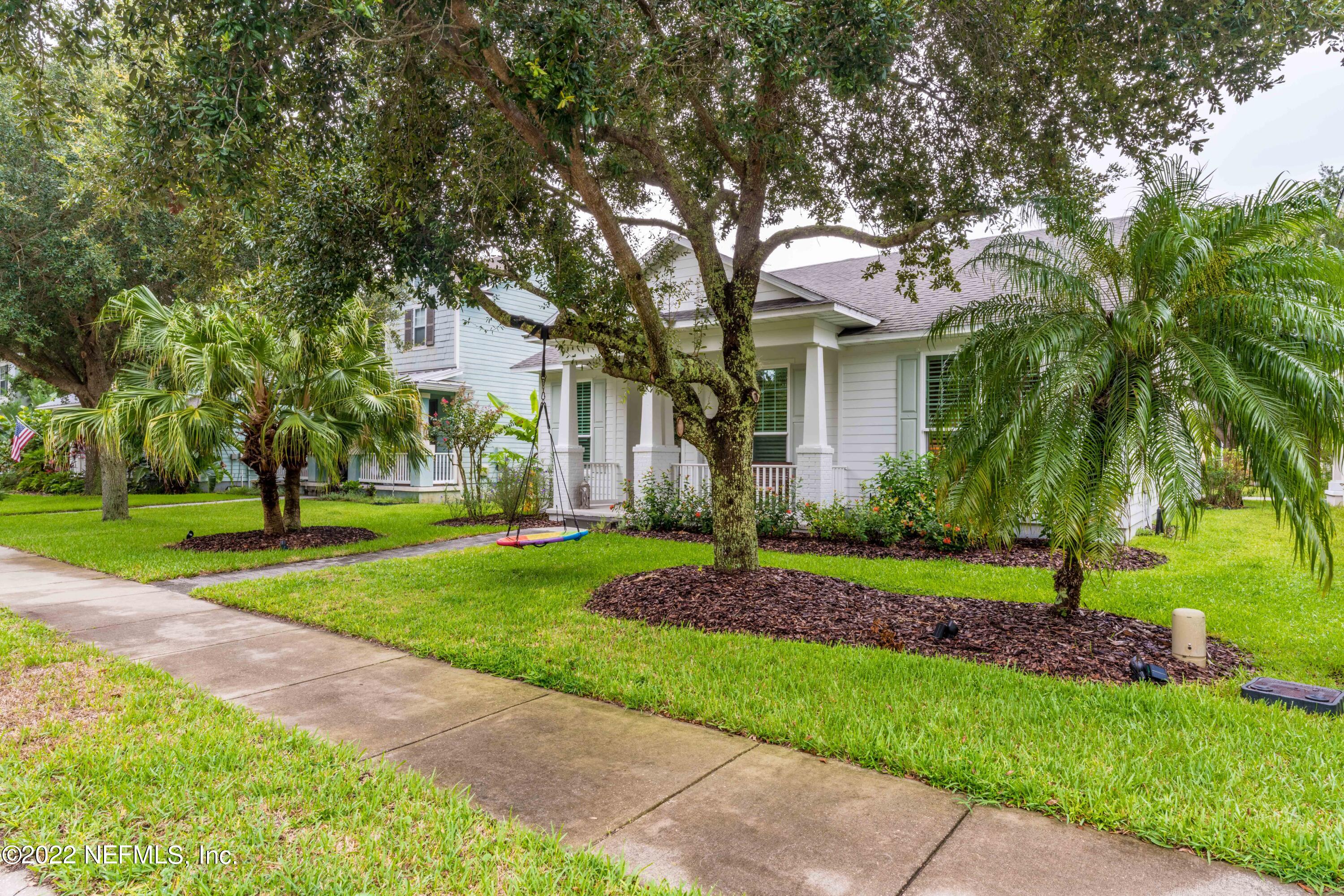 1145 Overdale Road St. Augustine, FL 32080 - Photo 2 of 85 a front view of a house with a yard and potted plants
