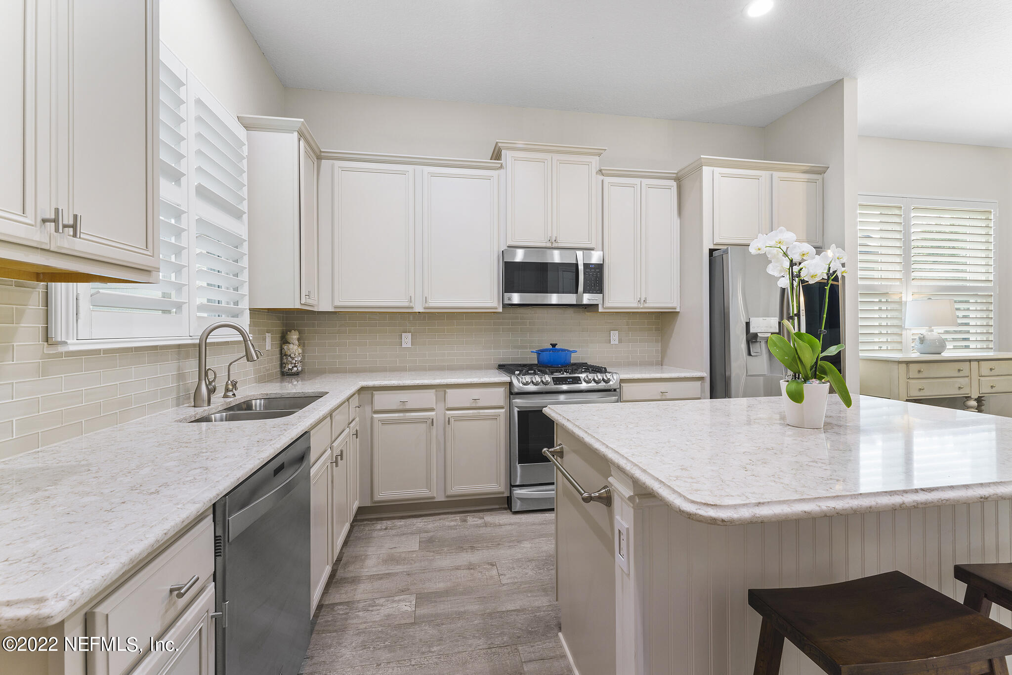 1145 Overdale Road St. Augustine, FL 32080 - Photo 22 of 85 a kitchen with granite countertop a sink a stove and cabinets
