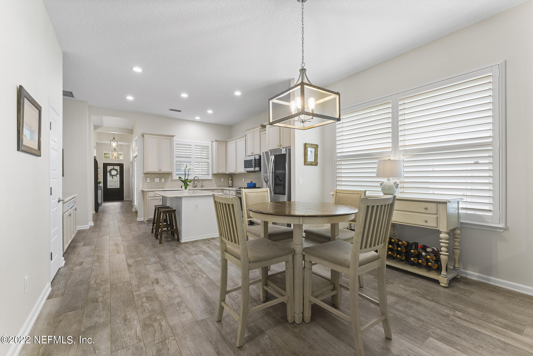 1145 Overdale Road St. Augustine, FL 32080 - Photo 24 of 85 a view of a dining room with furniture window and wooden floor