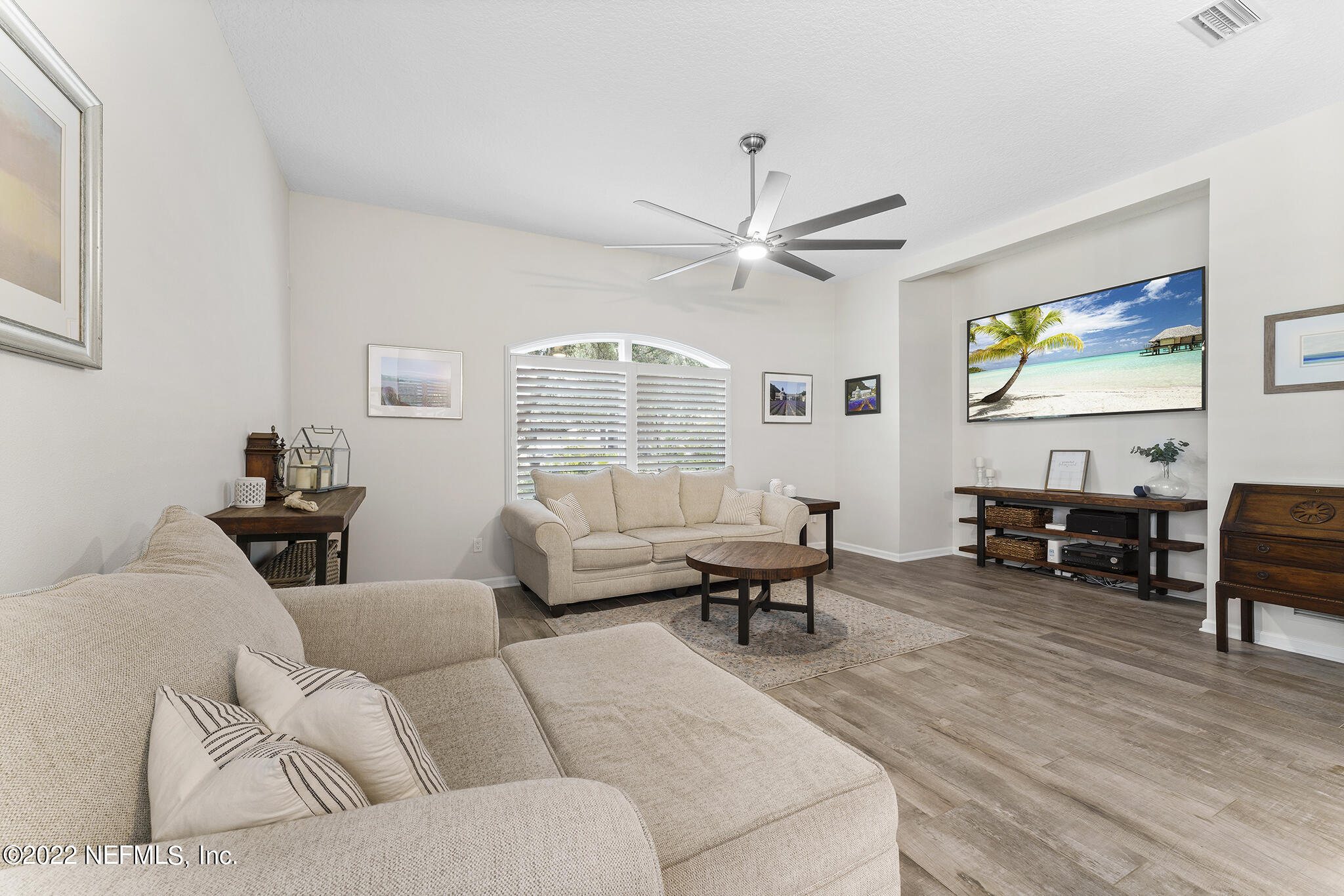 1145 Overdale Road St. Augustine, FL 32080 - Photo 27 of 85 a living room with furniture and a flat screen tv with wooden floor