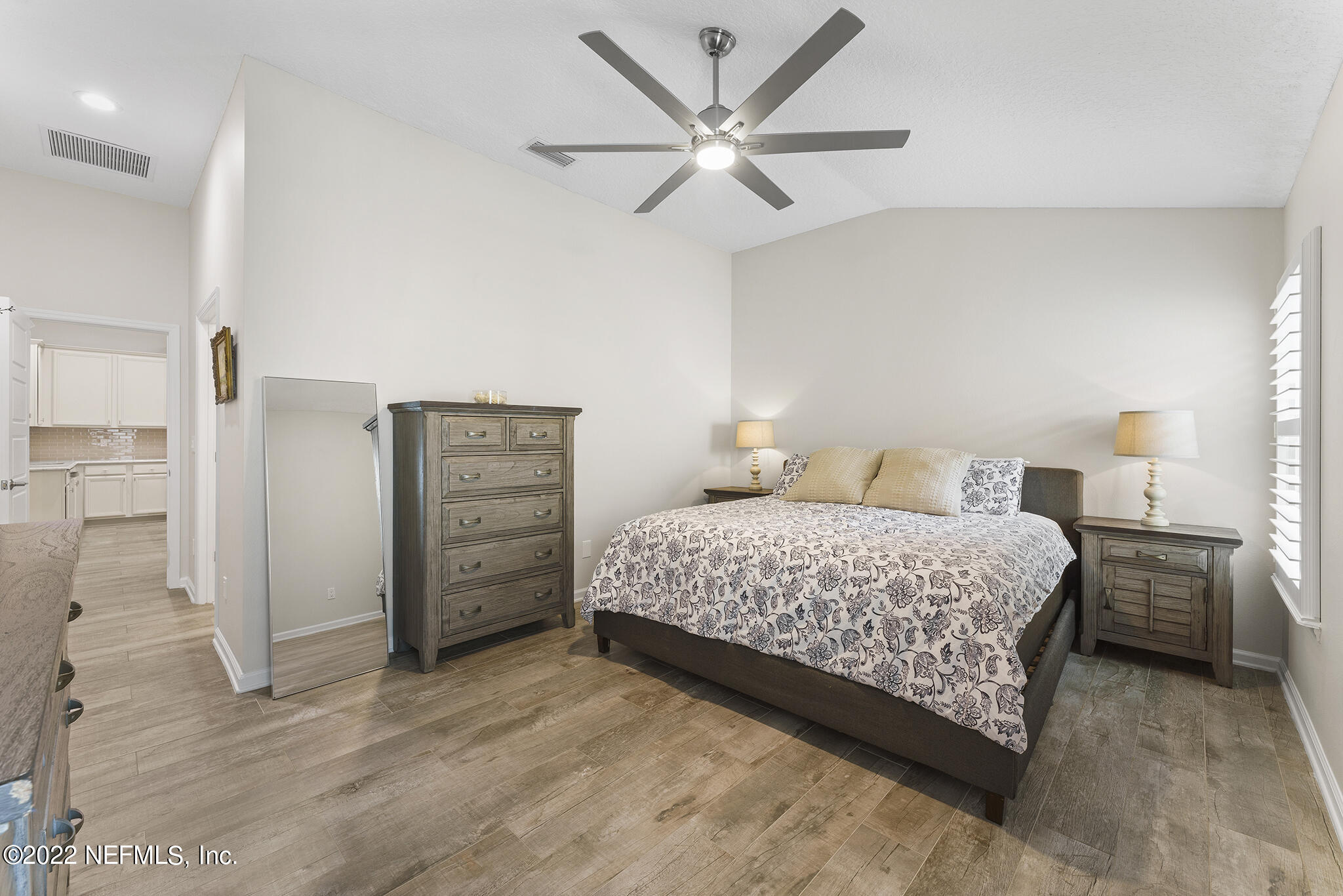 1145 Overdale Road St. Augustine, FL 32080 - Photo 29 of 85 a bedroom with a bed closet and wooden floor