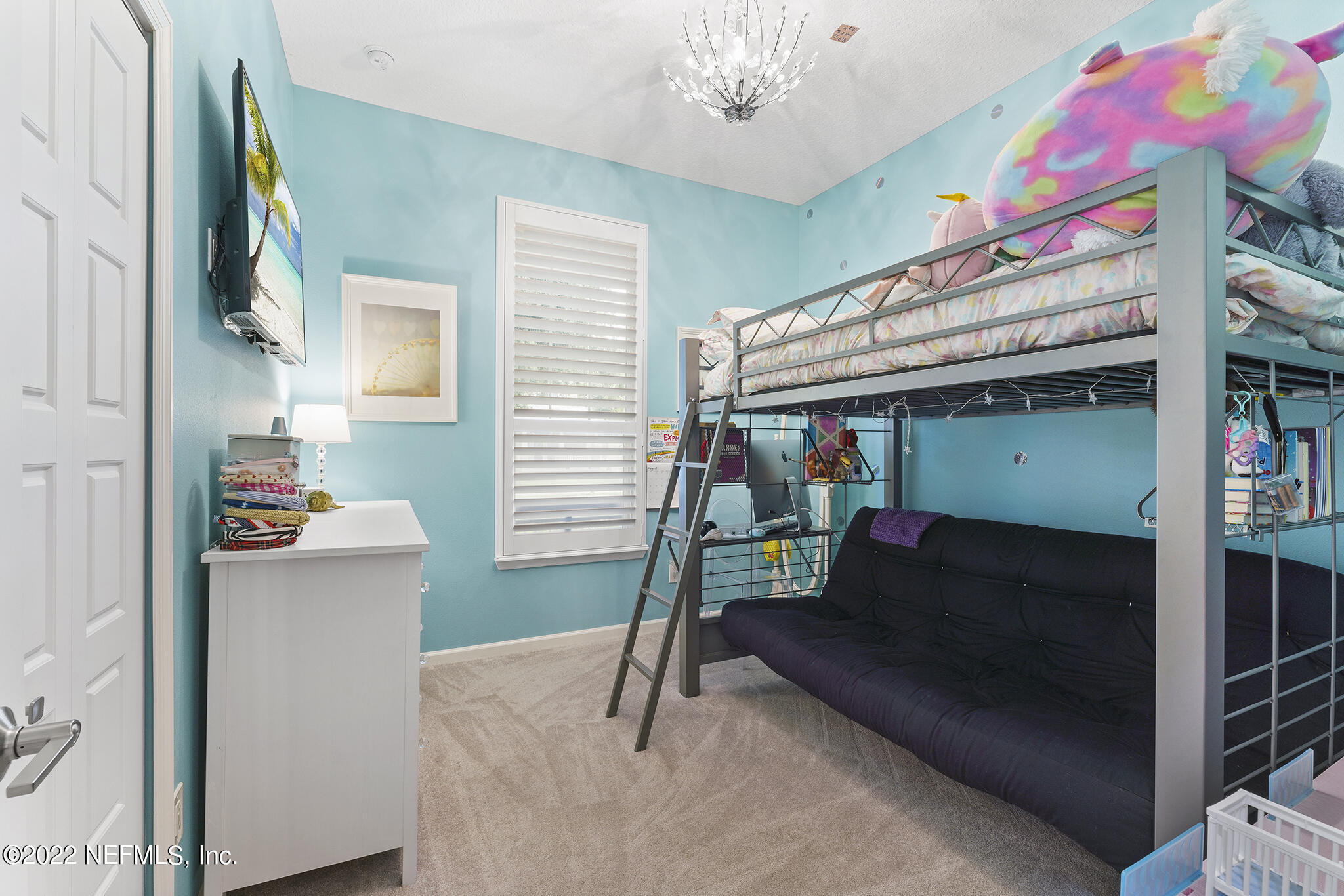 1145 Overdale Road St. Augustine, FL 32080 - Photo 35 of 85 a bedroom with a bed and a chandelier