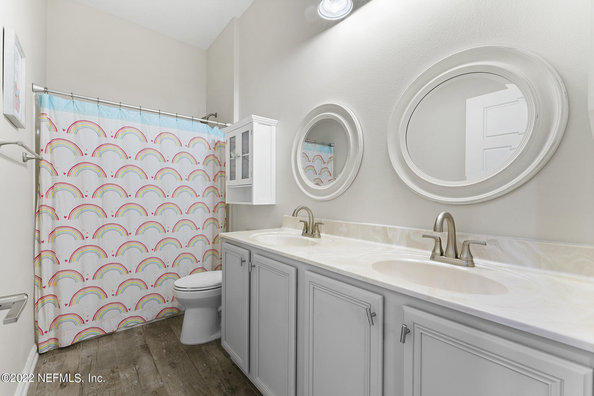 1145 Overdale Road St. Augustine, FL 32080 - Photo 37 of 85 a bathroom with a toilet a sink and a mirror