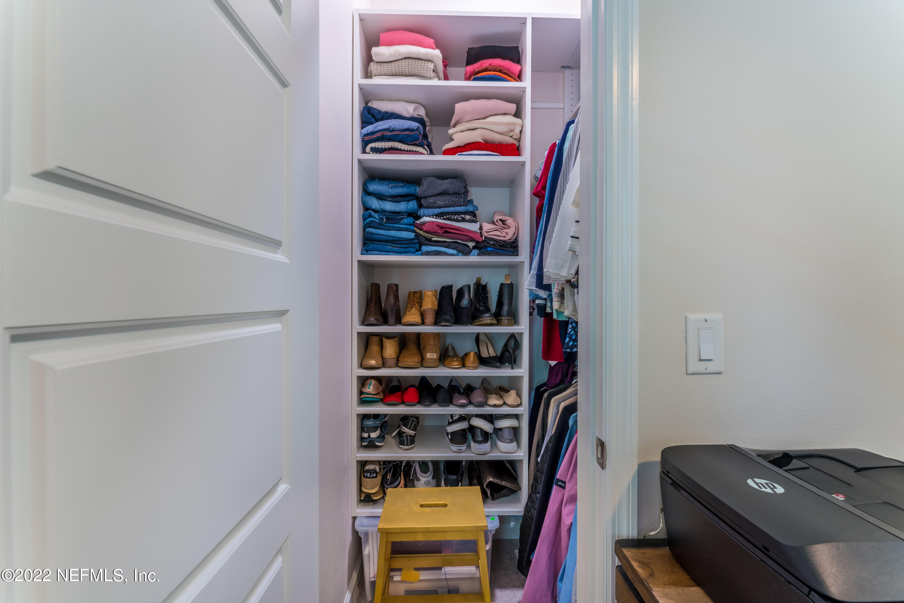 1145 Overdale Road St. Augustine, FL 32080 - Photo 42 of 85 a view of walk in closet with clothes and shoes