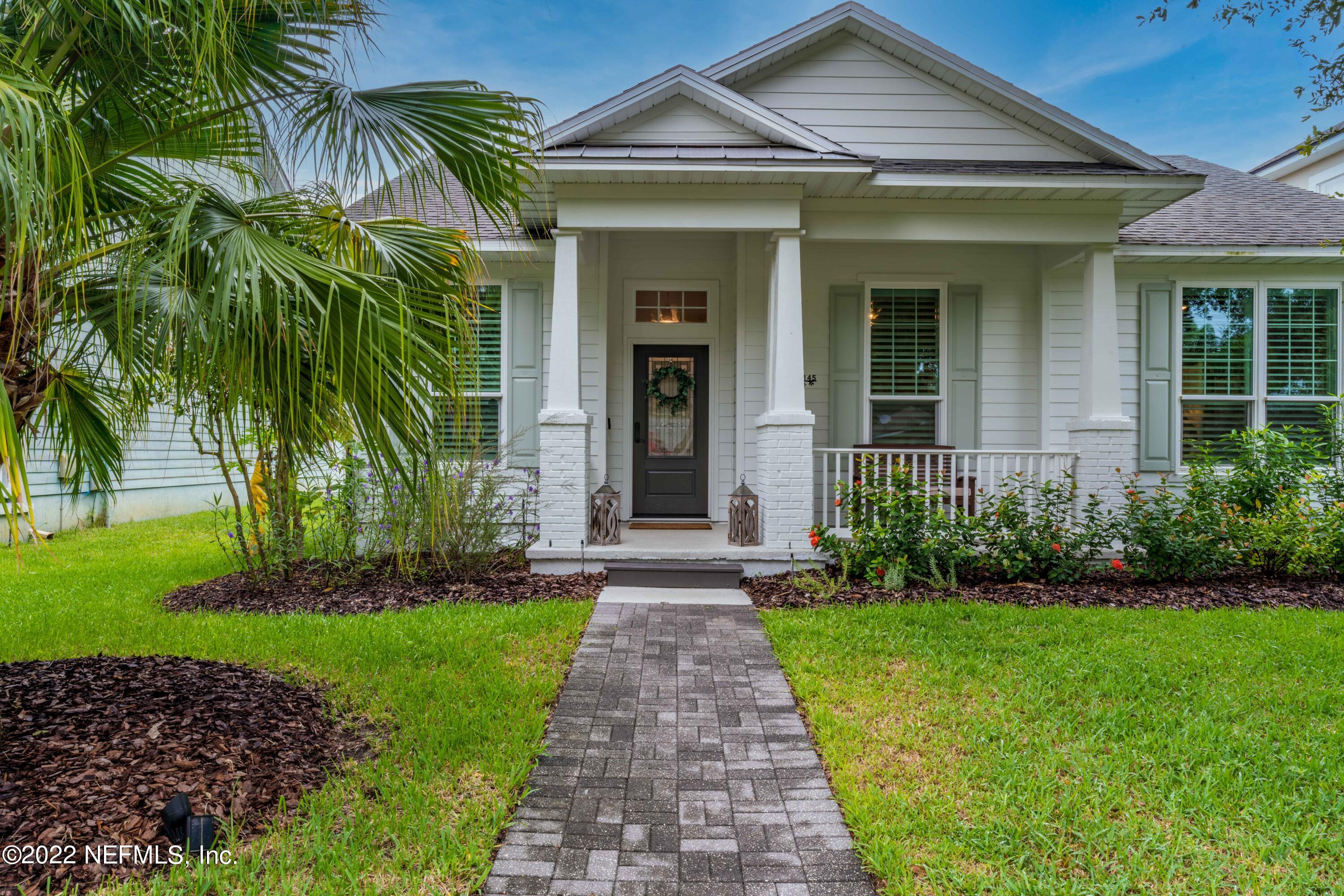 1145 Overdale Road St. Augustine, FL 32080 - Photo 5 of 85 a front view of a house with a garden