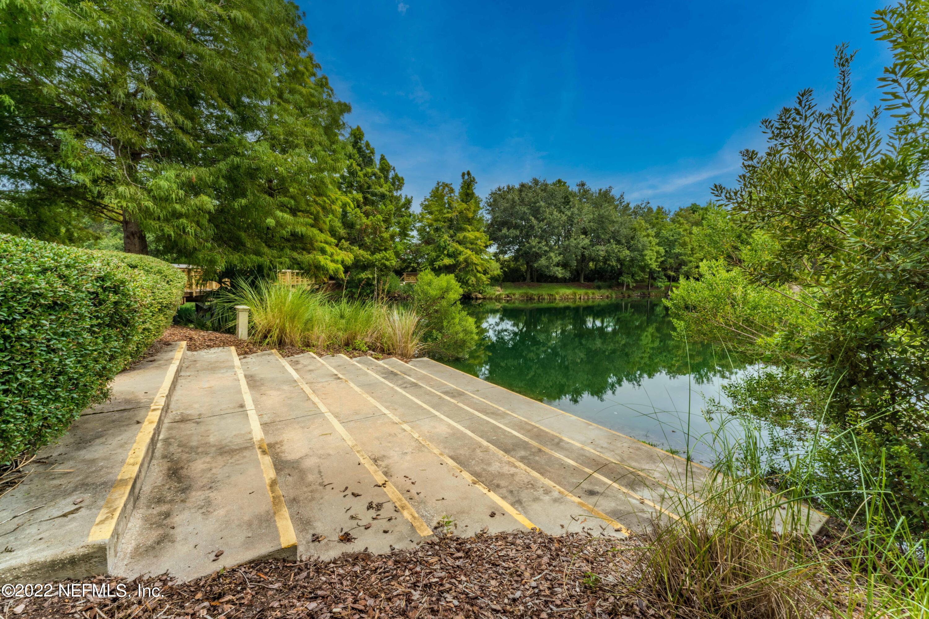 1145 Overdale Road St. Augustine, FL 32080 - Photo 67 of 85 a view of backyard with plants and lake