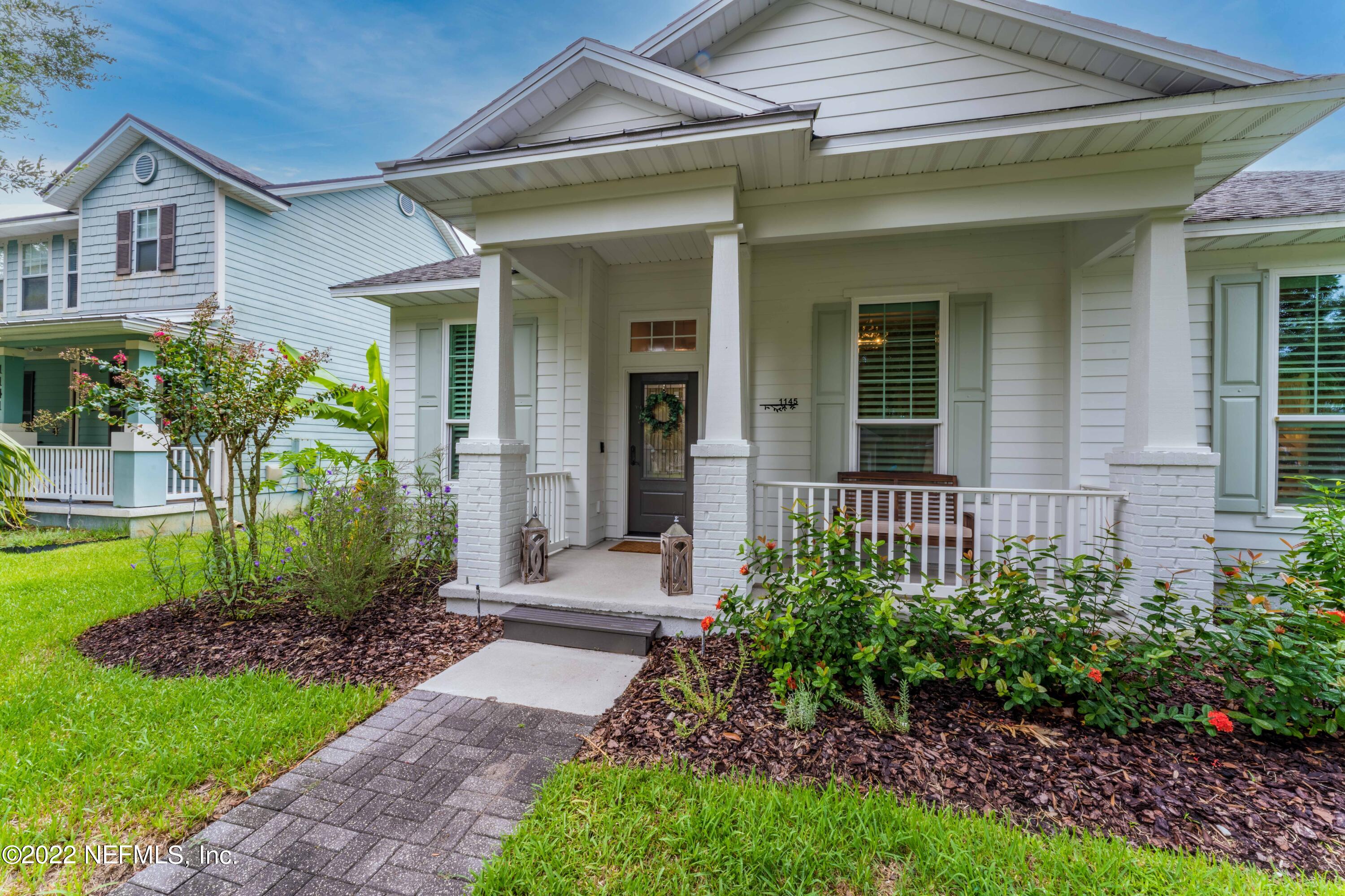 1145 Overdale Road St. Augustine, FL 32080 - Photo 8 of 85 a view of a house with brick walls and a yard with plants
