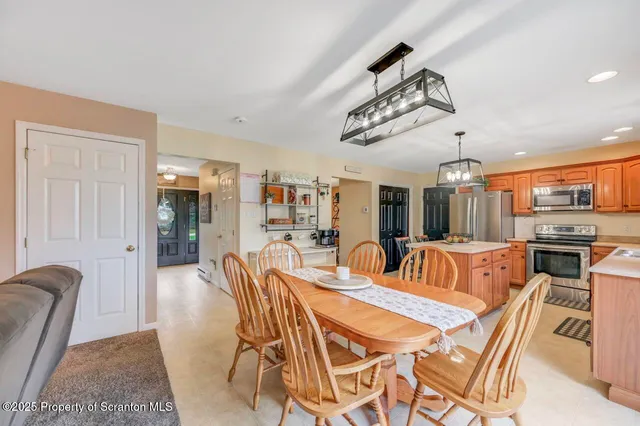 a view of a dining room with furniture window and outside view