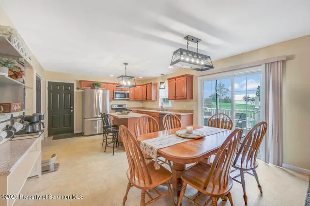 a very nice looking dining room with a table and chairs