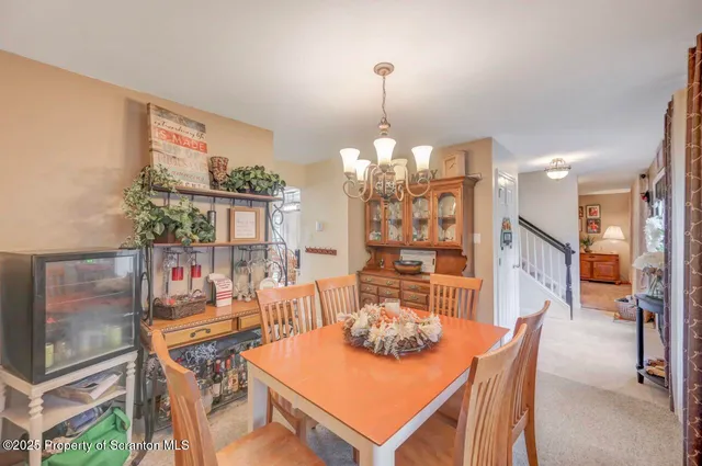a bathroom with a toilet and a shower curtain