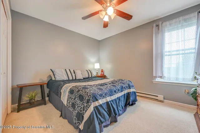 a view of a house with swimming pool and a yard