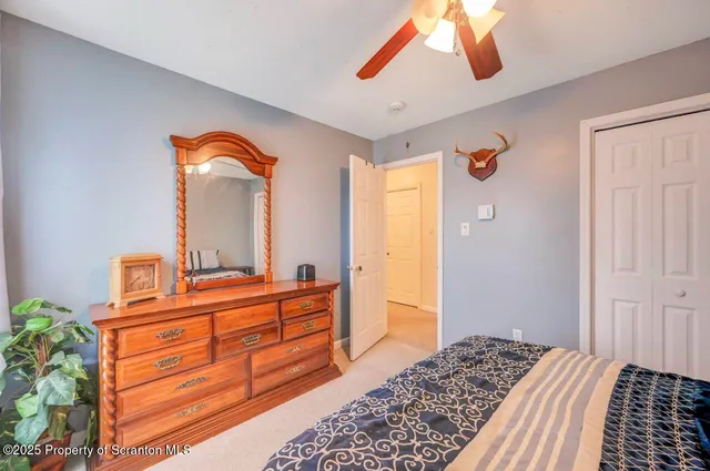 a view of a hallway with closet and a livingroom view