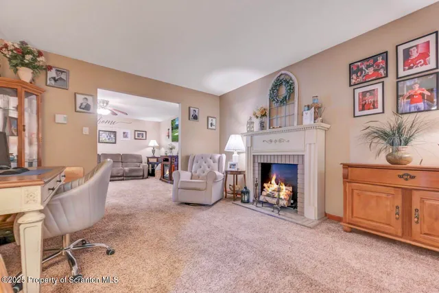a living room with furniture and a fireplace