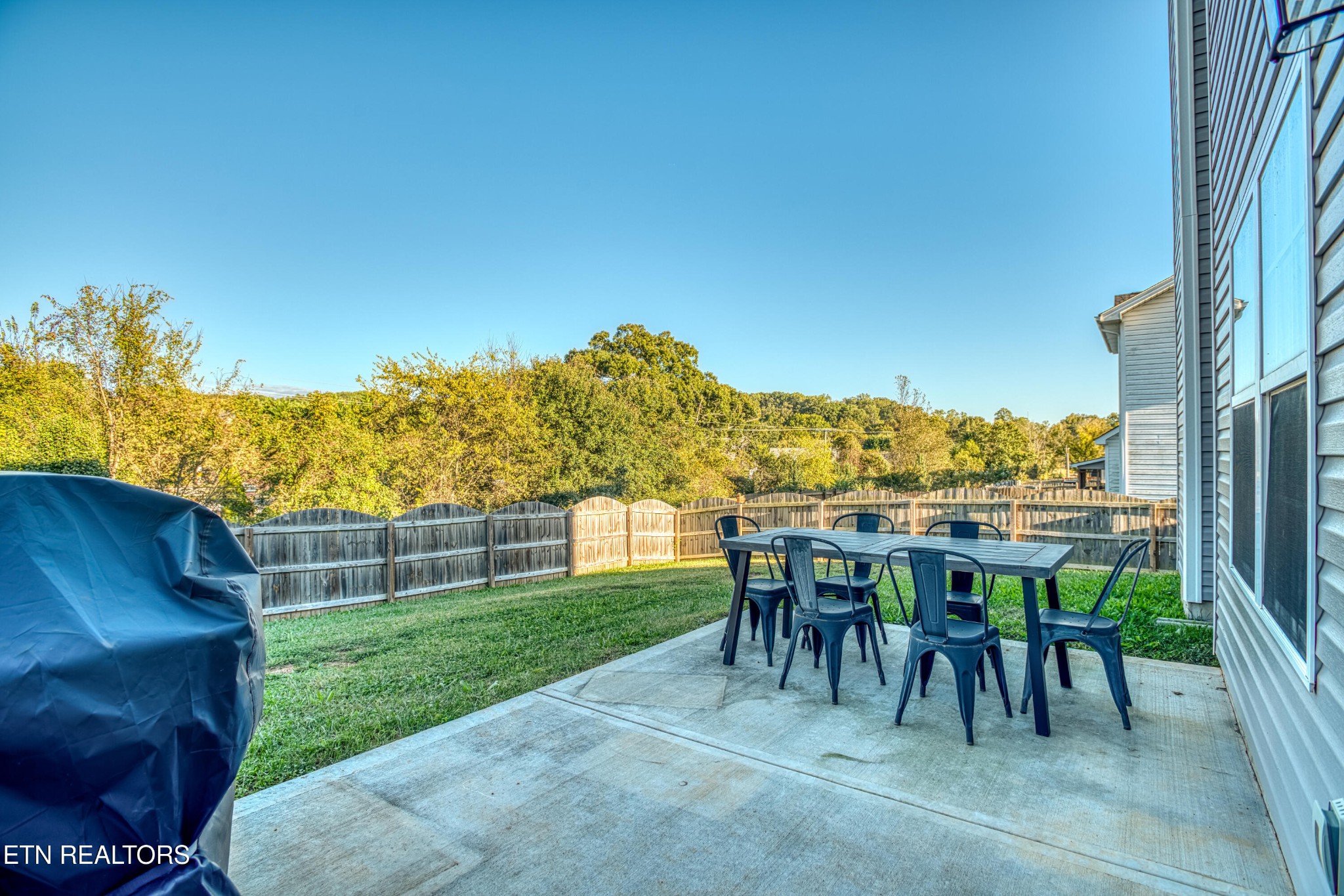 8232 Zodiac Lane Powell, TN 37849 - Photo 12 of 22 a view of a chairs and table in patio