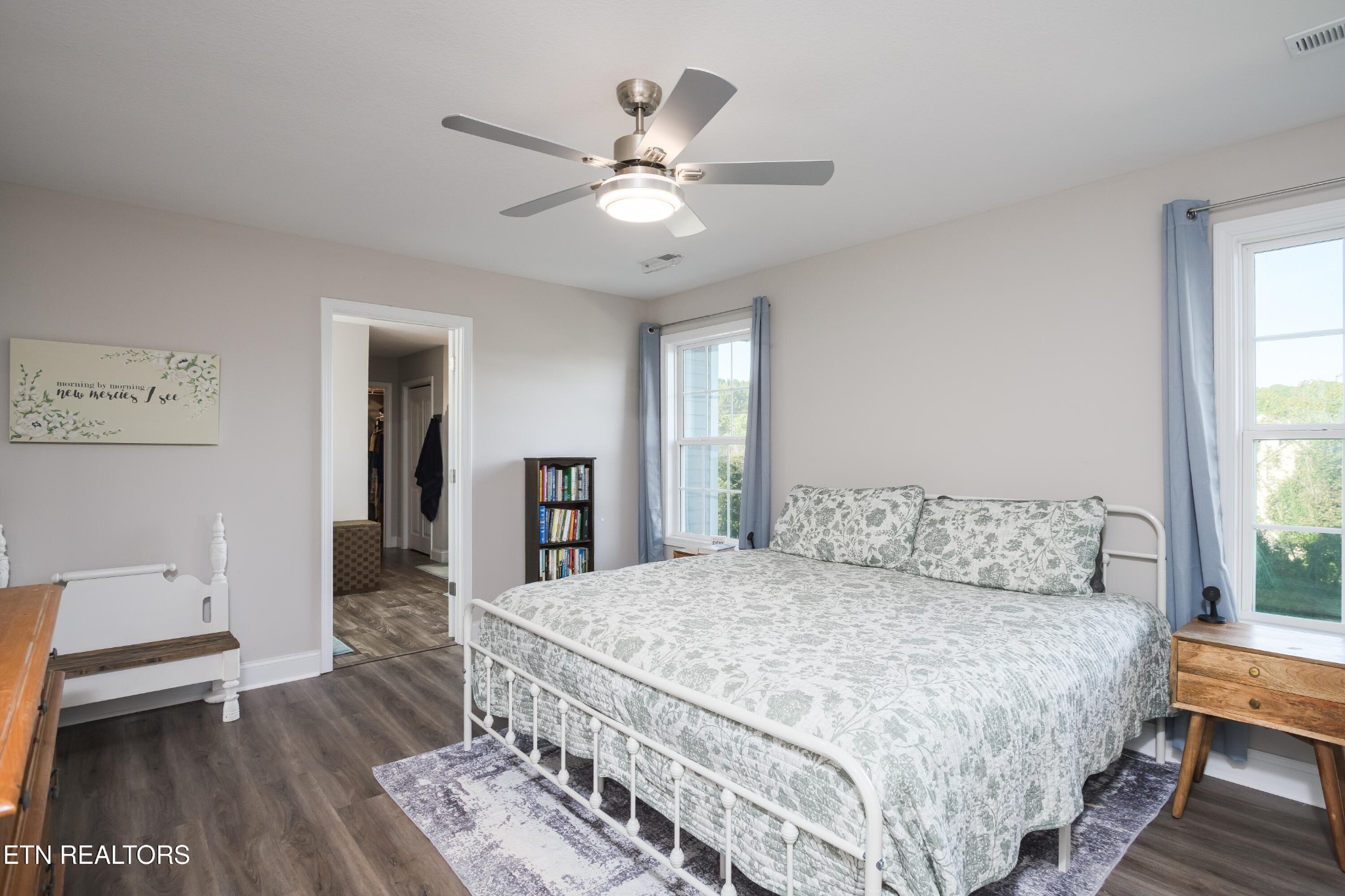 8232 Zodiac Lane Powell, TN 37849 - Photo 15 of 22 a bedroom with a large bed and a chandelier