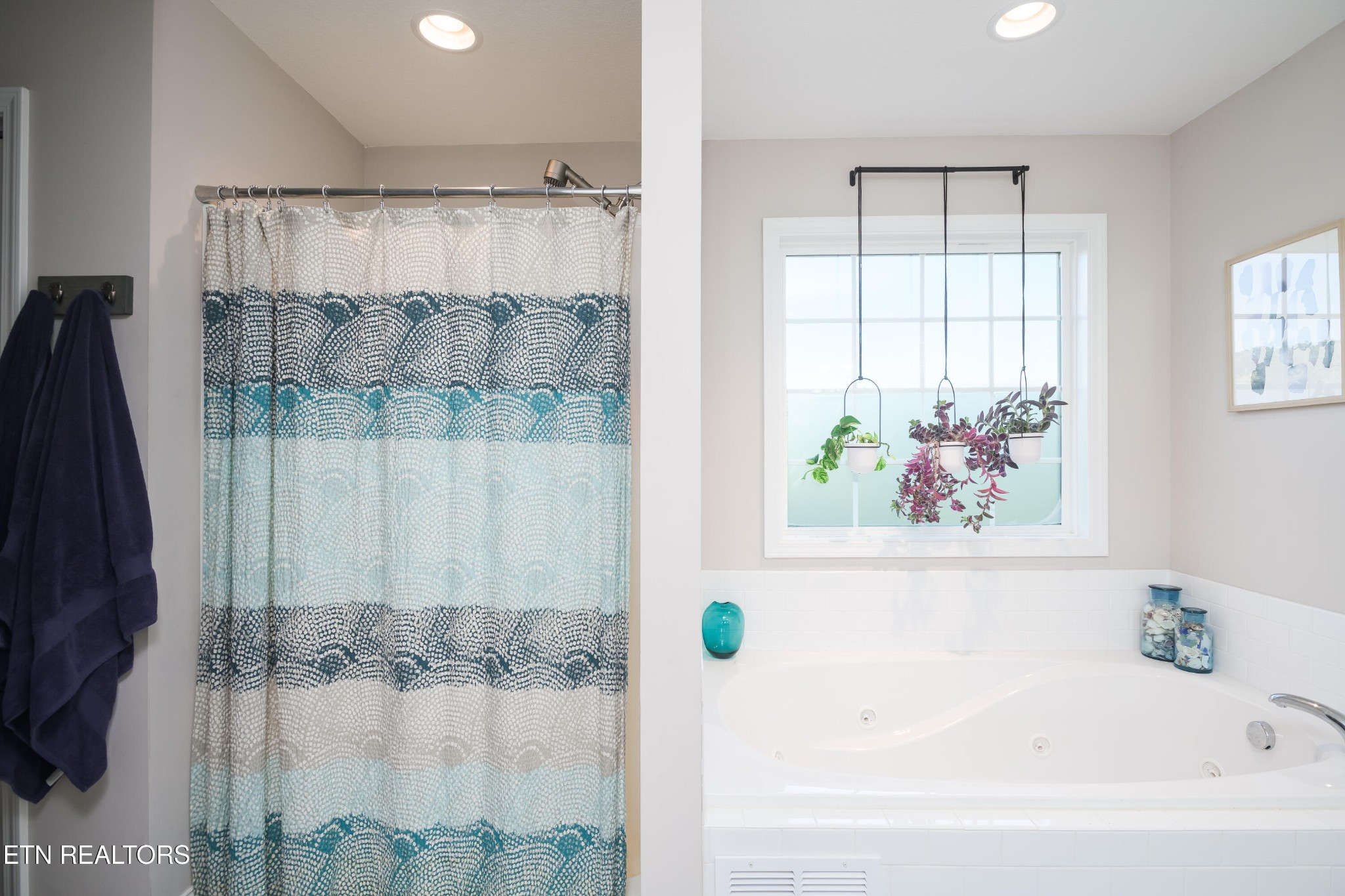 8232 Zodiac Lane Powell, TN 37849 - Photo 17 of 22 a bathroom with a bathtub and a shower
