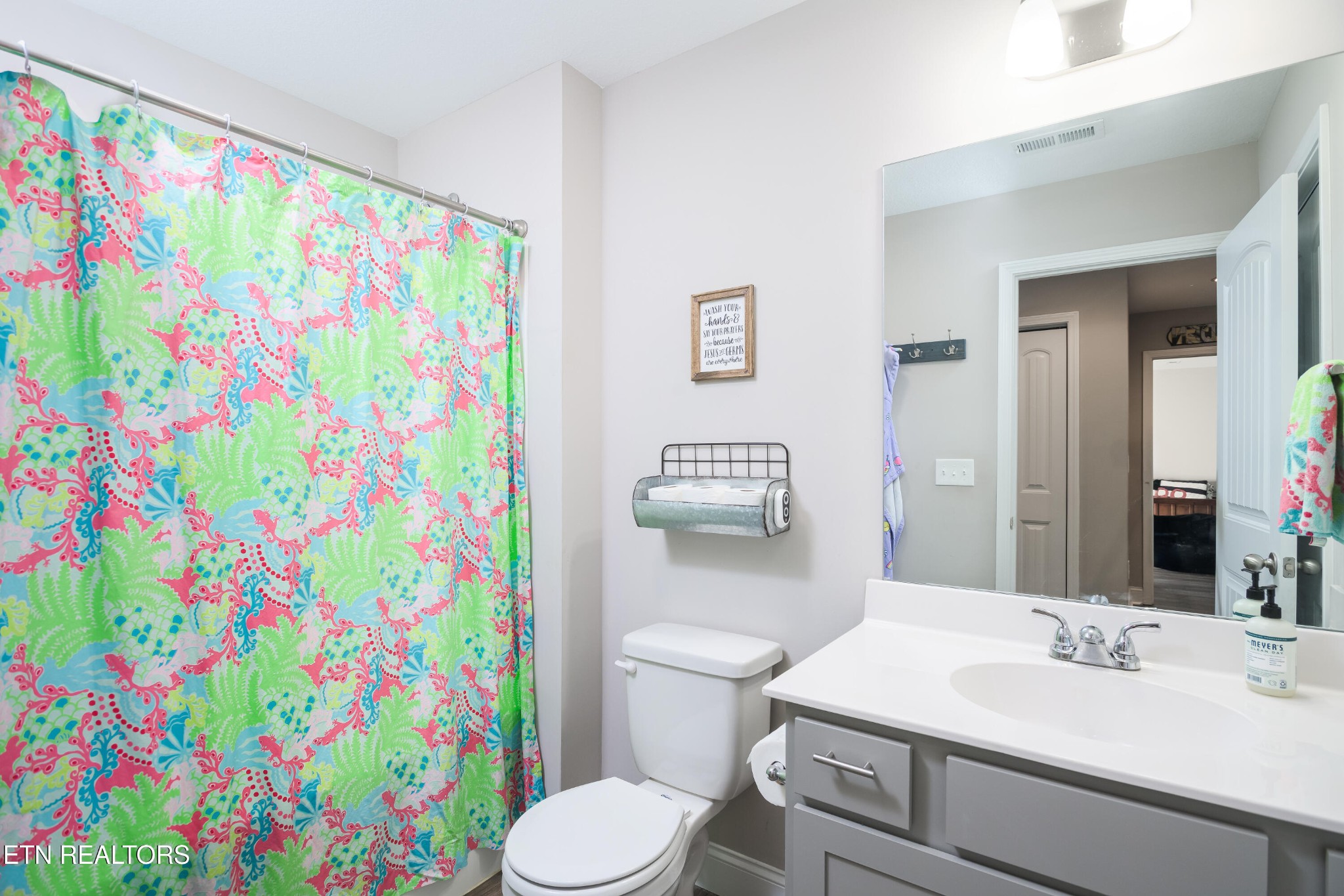 8232 Zodiac Lane Powell, TN 37849 - Photo 20 of 22 a bathroom with a sink toilet and a mirror