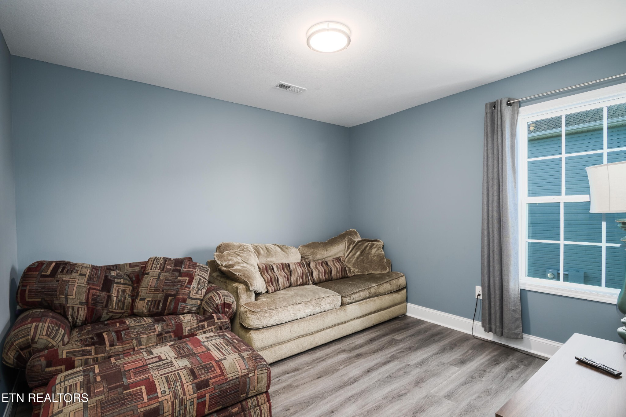 8232 Zodiac Lane Powell, TN 37849 - Photo 21 of 22 a living room with a couch and a window