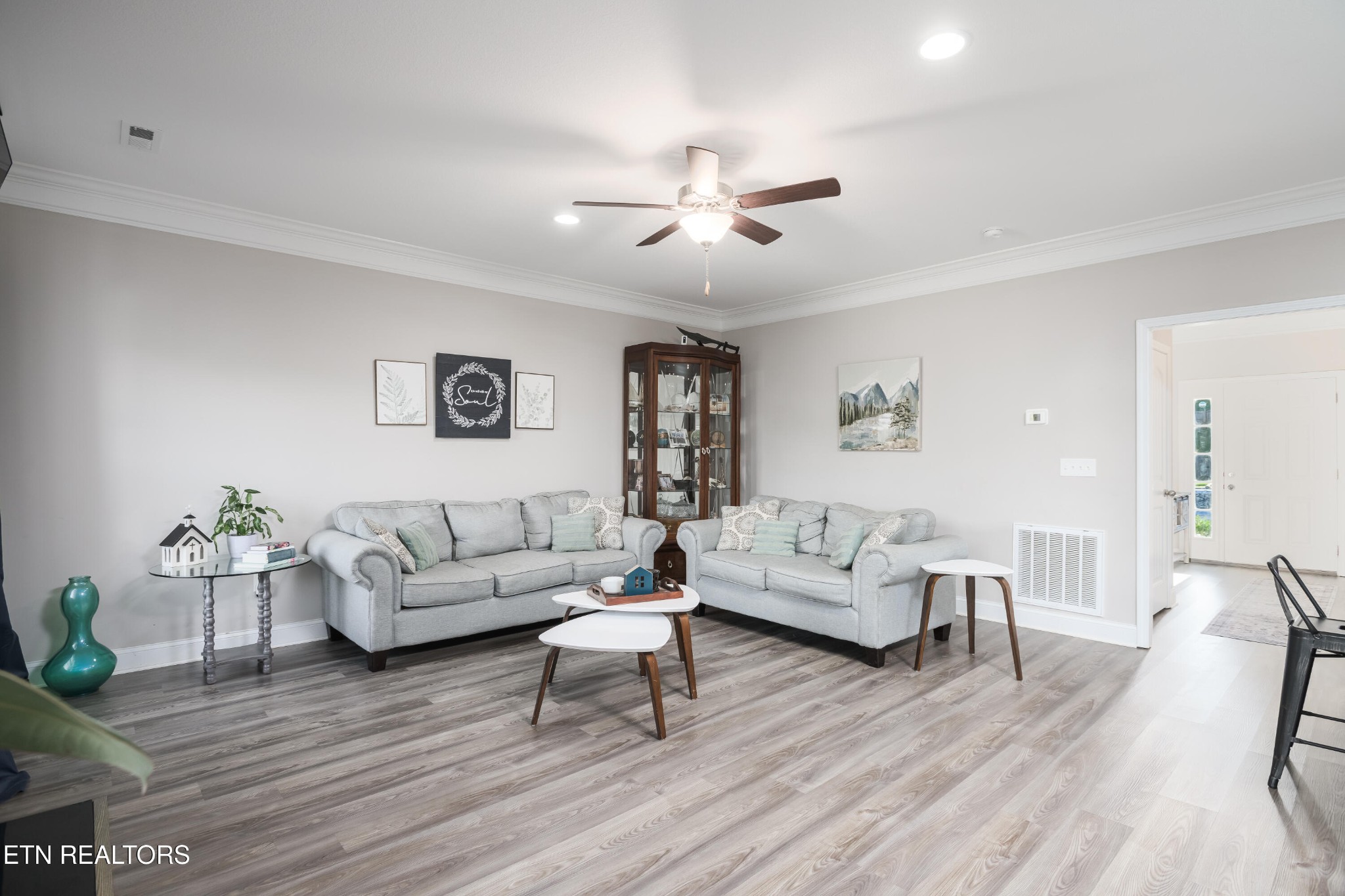 8232 Zodiac Lane Powell, TN 37849 - Photo 4 of 22 a living room with furniture and a wooden floor