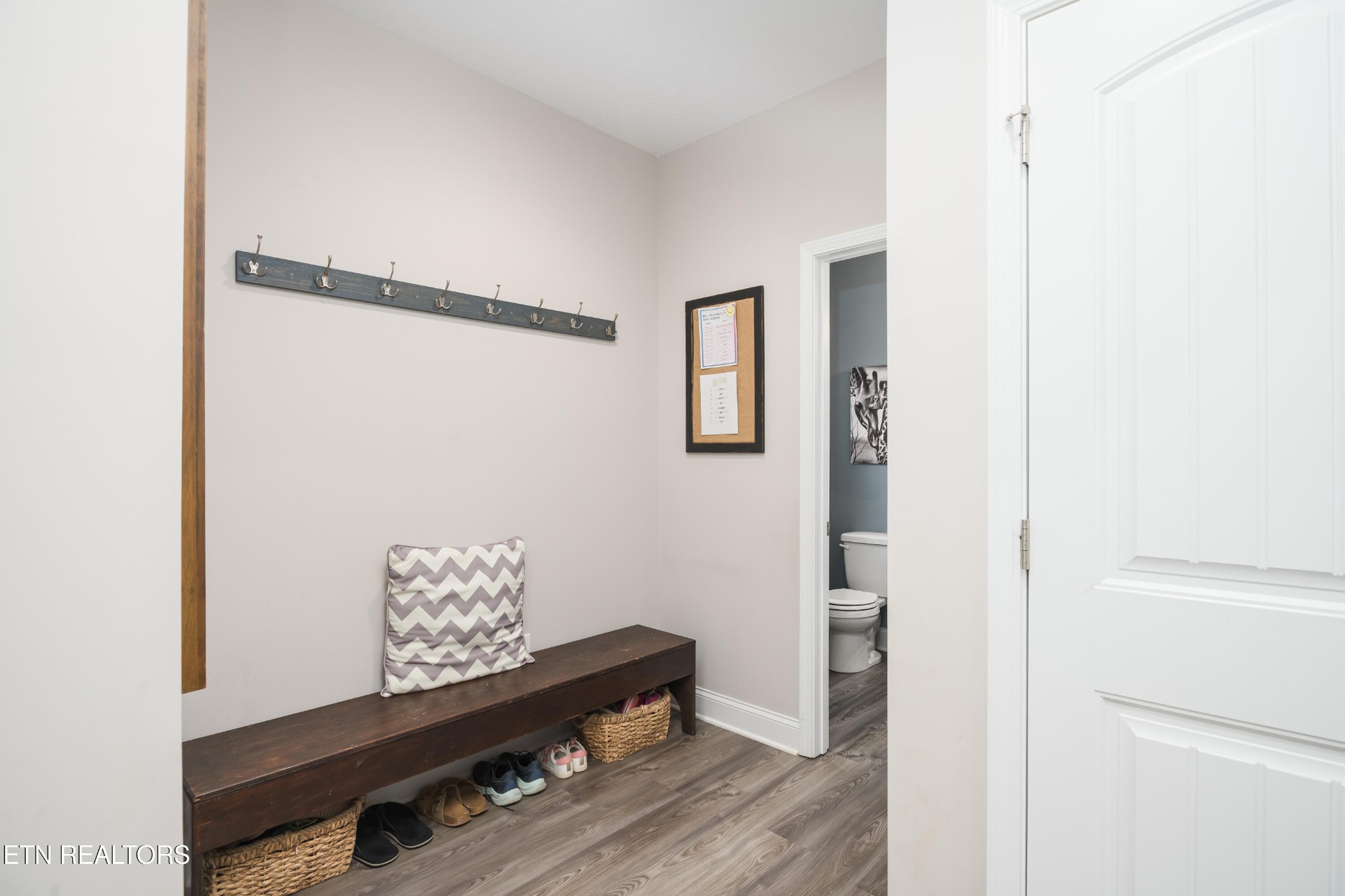 8232 Zodiac Lane Powell, TN 37849 - Photo 9 of 22 a view of an entryway with wooden floor