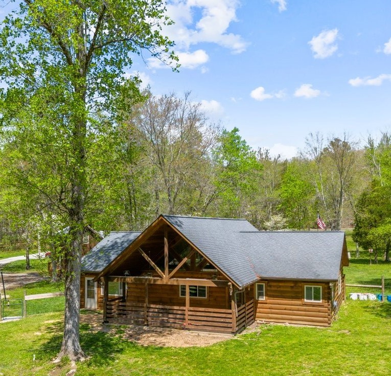 13631 Birdsong Road Holladay, TN 38341 - Photo 13 of 67 a front view of a house with a yard