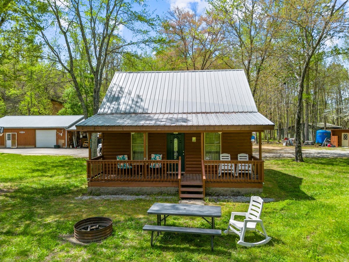 13631 Birdsong Road Holladay, TN 38341 - Photo 2 of 67 a view of a house with backyard porch and sitting area
