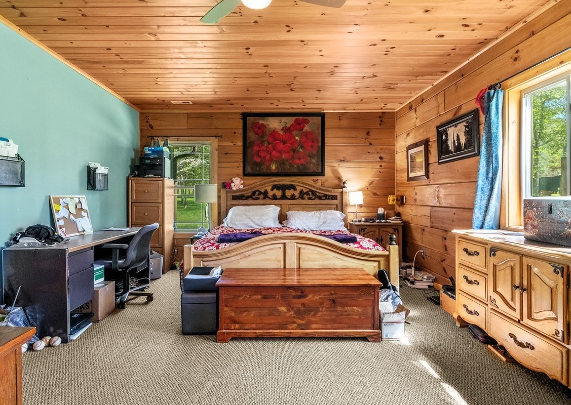 13631 Birdsong Road Holladay, TN 38341 - Photo 31 of 67 a living room with furniture a flat screen tv and a refrigerator