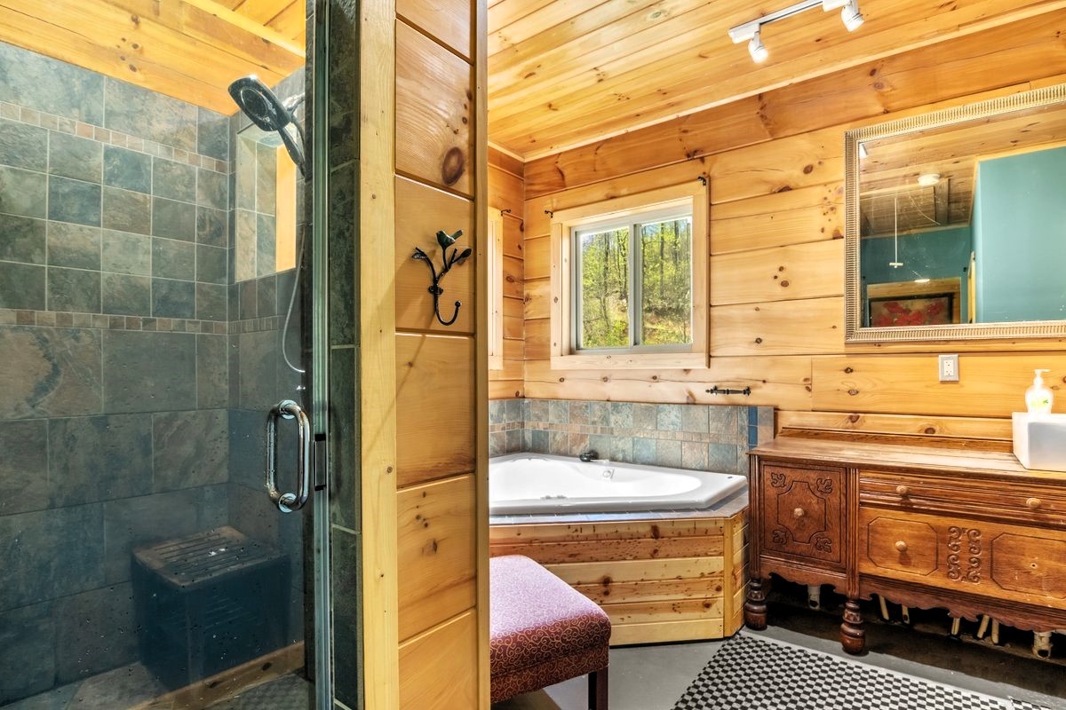 13631 Birdsong Road Holladay, TN 38341 - Photo 33 of 67 a bathroom with a sink a toilet and shower