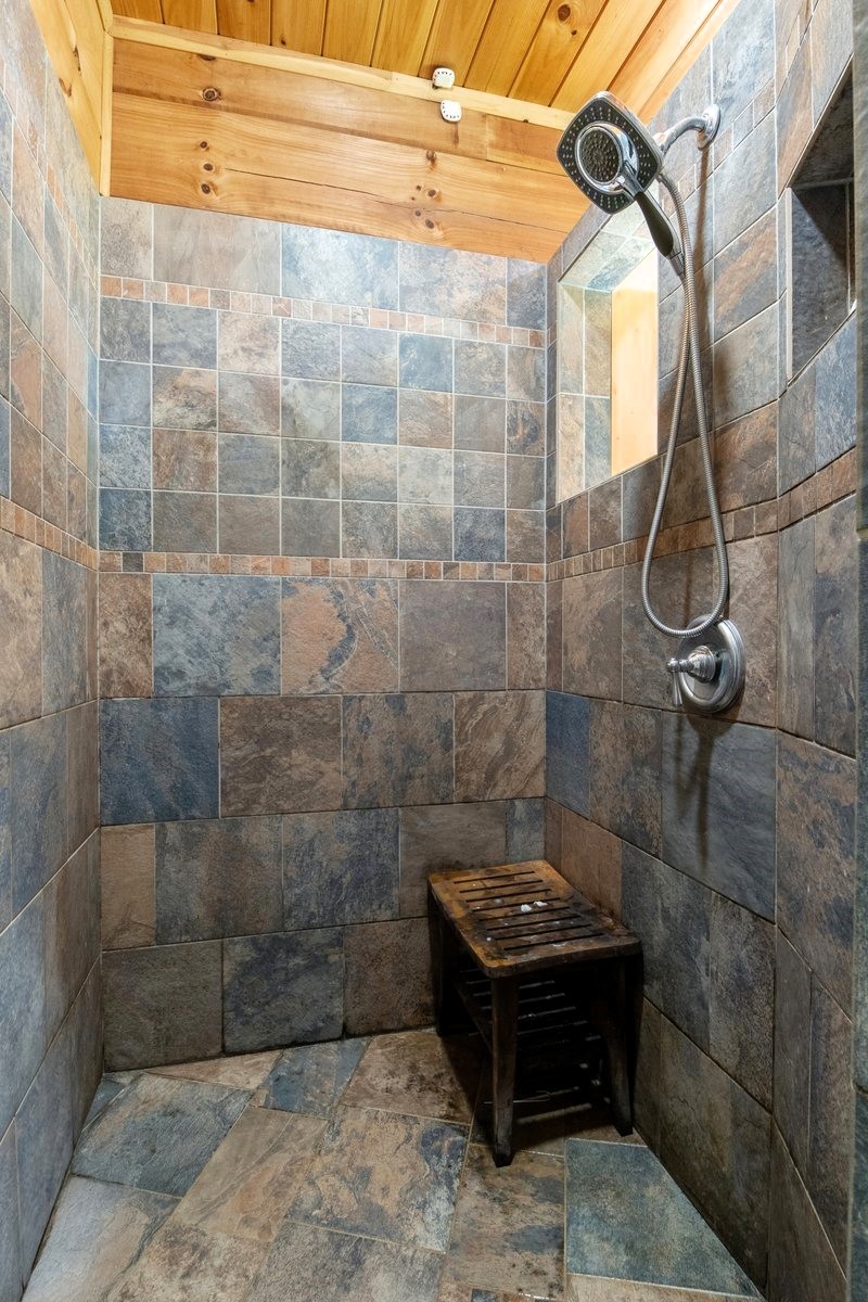 13631 Birdsong Road Holladay, TN 38341 - Photo 34 of 67 a bathroom with a sink a toilet and shower